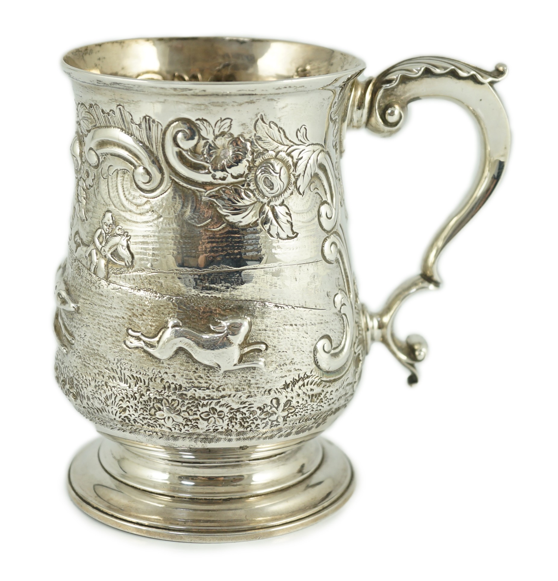 A George III silver baluster mug, later embossed with continuous hare coursing scene, John Scofield